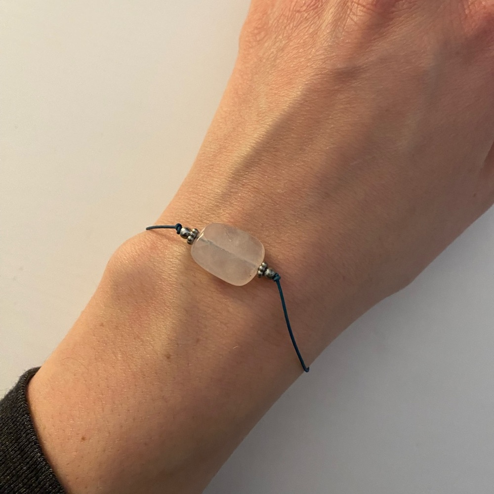 Simple string bracelet- light pink stone, blue string, silver clasp